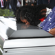 Myeshia Johnson kisses the casket of her husband U.S. Army Sgt. La David Johnson during his burial service at the Memorial Gardens East cemetery on October 21, 2017 in Hollywood, Florida. Image via Getty.